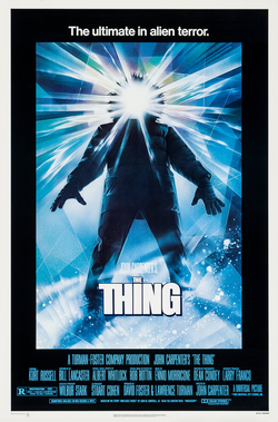 The movie poster for The Thing featuring a hooded figure with light pouring from where his face should be.